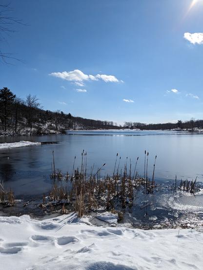Lake Marcia at high point state park , NJ, snow in the foreground.
