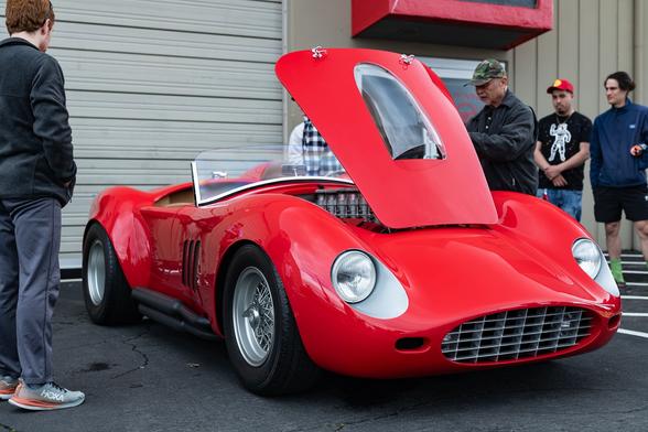 A red Cobra with its hood open