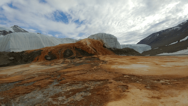 Blood Falls, Antarctica, where microbes live under the ice. Iron and other elements from the bedrock below the ice become oxidized when it interacts with air, producing the rusty red coloring.