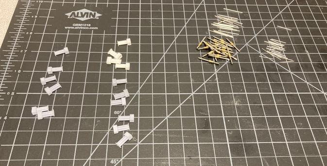 Photo of the “ingredients” of hyperdrive shuttles: shuttle molds, different types of cannulas, threaded rod with nut