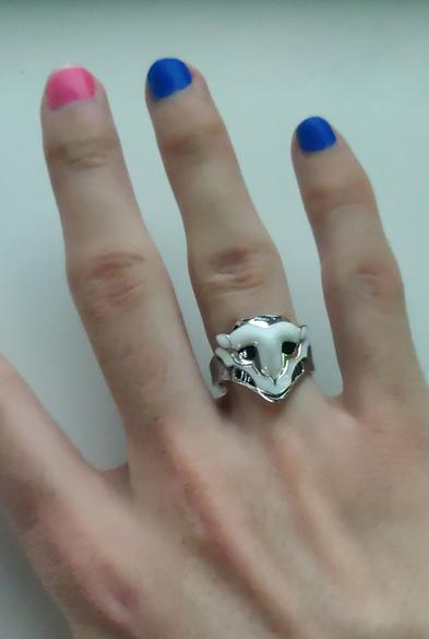 Picture of my hand with a Firelights mask ring. My nail polish is the Jinx one.