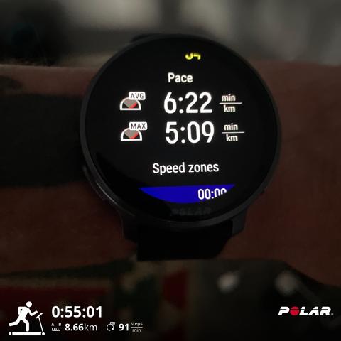 Polar running watch showing average and max pace with run stats at bottom