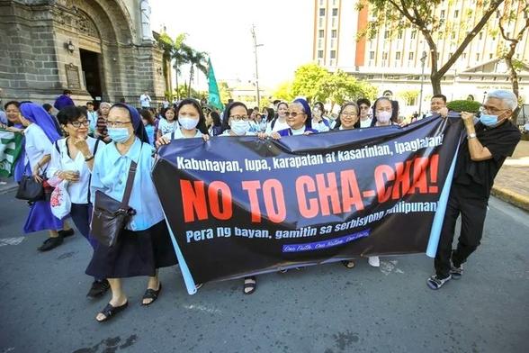 NO TO CHA-CHA. Members of Siklab, a new coalition to oppose charger change, stage a protest in front of the Manila Cathedral, February 22, 2024. Photo by Rappler