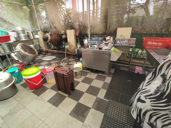 the washing up area of a langgar (community kitchen) in a neighbourhood gurdwara (Sikh temple).