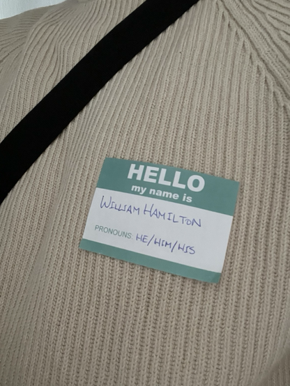 Name tag reading “William Hamilton; Pronouns: He/Him/His”