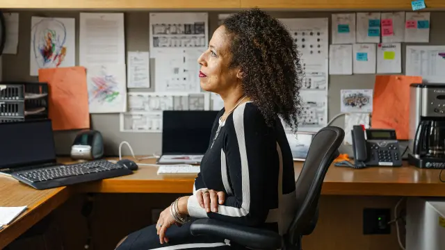 black woman sitting in her office
