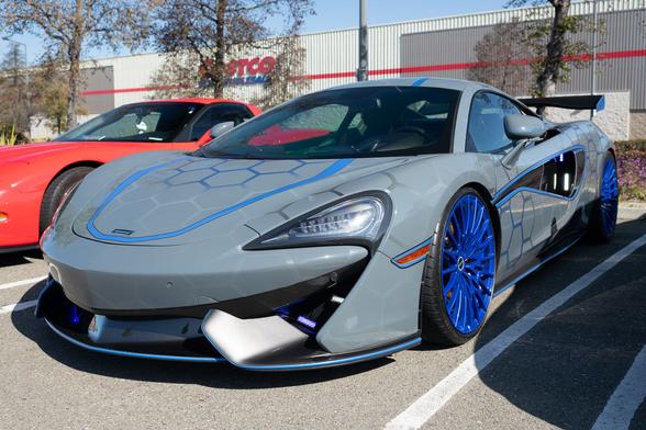 Gray exotic sports car with hexagonal decal patterns