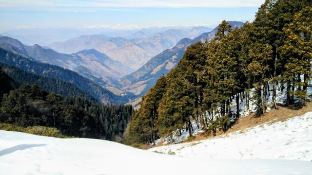 Often referred to as a mesmerising "hamlet" situated amidst the lush green forests and surrounded by variegated mountains, Jibhi is located in the Tirthan Valley of Himachal Pradesh. This view is from Jalori Pass.