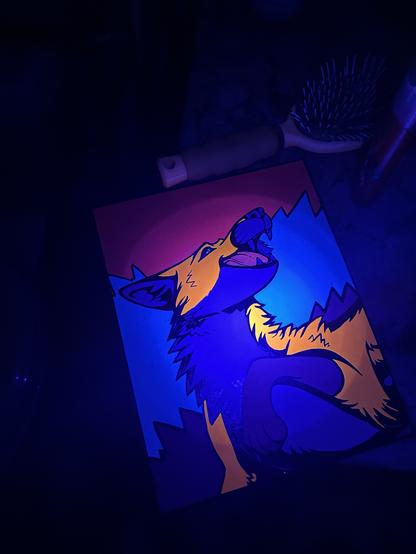 Colorful artwork of a fox under a black light.