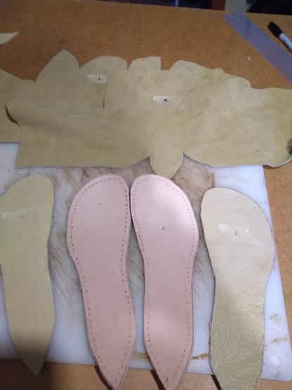 Chrome tan elk leather cut out for one piece shoes. Thick veg tan midsole and elk leather sock liner below.