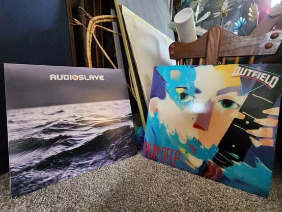Audioslave's Out of Exile album cover on the left
The Outfield's Play Deep album cover on the right