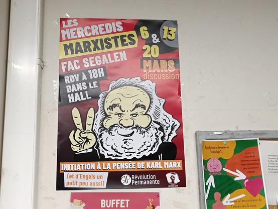 Photographie d’une impression du visuel (un magnifique visuel avec un dessin de Marx).