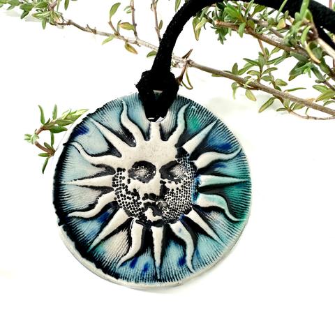 Ceramic sun pendant in blue by surlyramics