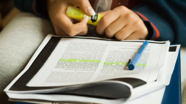 photo - student annotating a journal paper