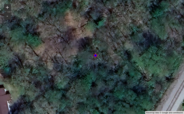 A map with a satellite image basemap, where the basemap is so dark that the location marker and label are hard to see.