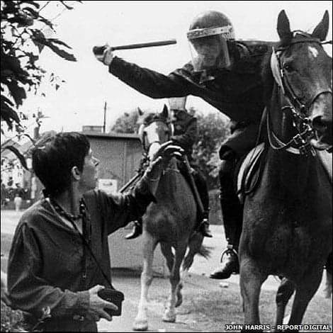 Mounted policeman goes to truncheon defenceless woman at Orgreave