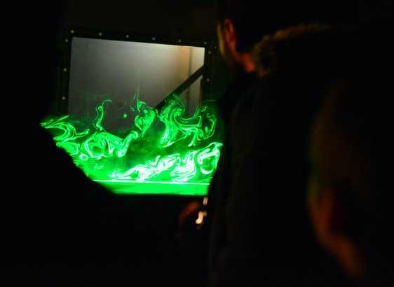 Participants getting an impression of the wind tunnel at Geomatikum