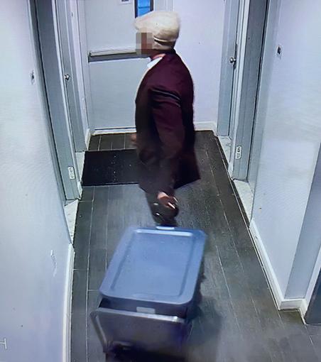 surveillance footage of suspect hauling bins out his apartment before a dismembered corpse was found in NYC.