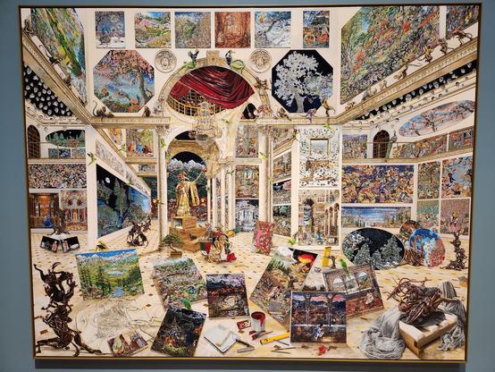 A painting of an enormous room filled with many other paintings, some hung on the walls but many stacked on the floor. These all illustrate the works of Raqib Shaw, so we see paintings of his familiar to us inside this painting.
