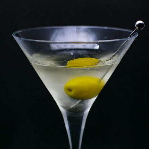 The cocktail itself in a chilled Martini glass and garnish with an olive