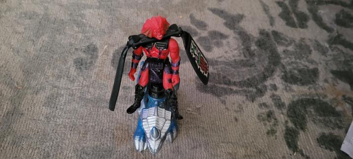 A red Galoob Dragon Flyz toy with dragon launcher.