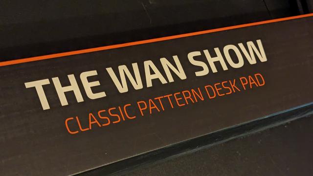 a photograph of the box containing The WAN Show Desk Pad from Linus Media Group