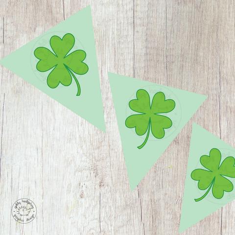 Three Shamrock banner triangles on a wooden background,