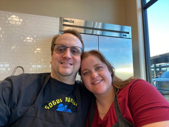 Picture of a Married Couple learning to cook.