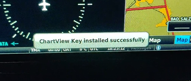 Closeup photo of an electronic flight instrument screen showing the message "ChartView Key installed successfully"
