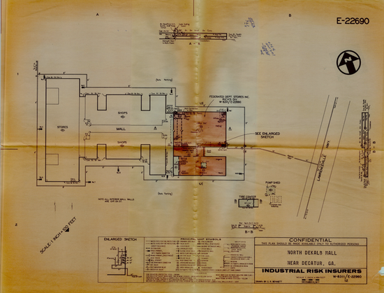 An architectural survey of North Dekalb Mall from 1977. It is very yellowed and has wear from being folded into fourths for decades. Going from left to right is a grocery store, then the main Mall with it's stores, and then a department store by the name of Rich's. To the right of that is the main highway.