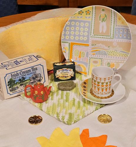 A tea tableau of an Irish scene with a Connemara Marble wishing stone and Irish Cream black tea from New English Teas.