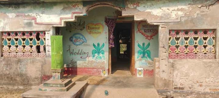 A house in Udaykini village with a fading traditional wedding painting on the wall. The village has not hosted a wedding in a decade.