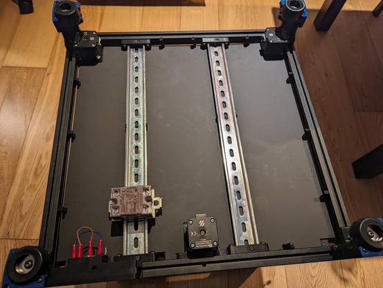 Bottom panel and din rails assembled