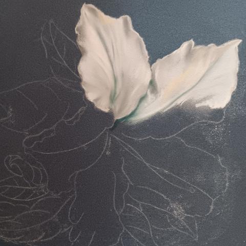 Soft pastel artwork in progress on blue paper depicting a white azalea blossom.