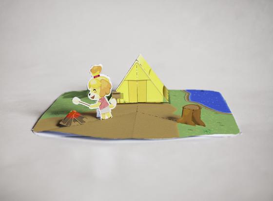 Foto de mi tarjeta de Animal Crossing. Canela la perrita asa un malvavisco sobre una hoguera. A su espalda, una tienda de campaña amarilla y un tocón.