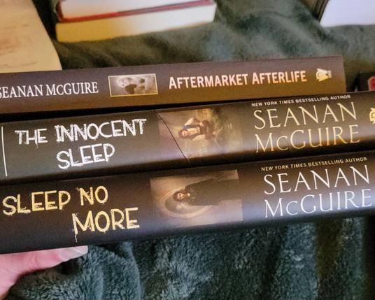 Photo of 3 books Two hard cover 1 soft cover.

All by seanan Mcguire.
Sleep nó more, innocent sleep and aftermarket afterlife.