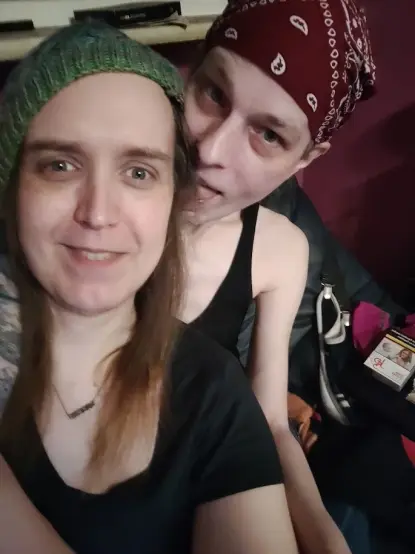 Two women, me and my girlfriend, cuddling