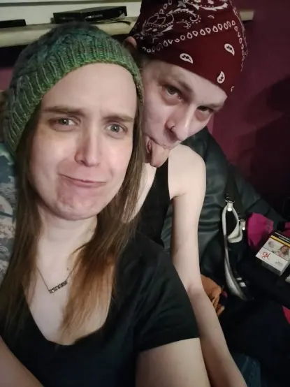 Two women, me and my girlfriend, cuddling