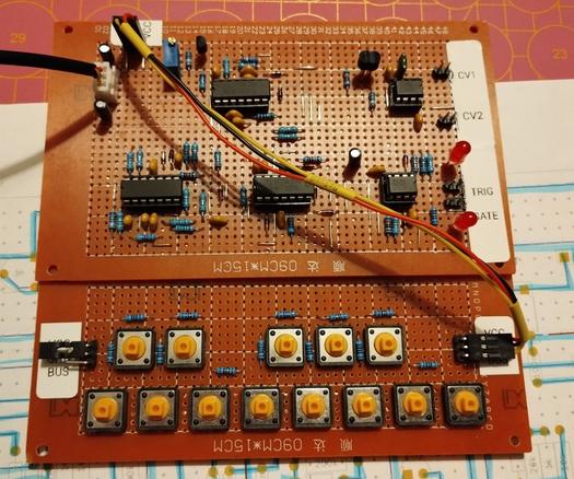 the finished board with all opamps in the sockets and the key perfboard attached. sadly it didn't "just work" at once