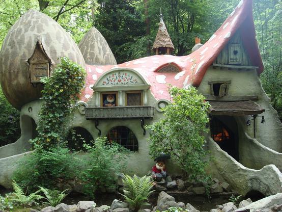 Alt text by AI:
The image depicts a whimsical house with mushroom-shaped structures, nestled amidst lush greenery. It evokes the enchanting ambiance of a fairytale setting, inviting curiosity and igniting the imagination.