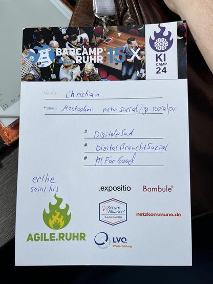 Ein Foto des Namensschildes des BarCamp Ruhrs mit allen Sponsoren Logos.