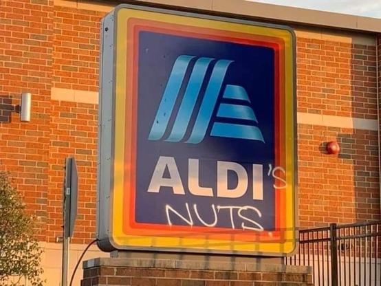 the Aldi logo, but someone has added on "'s nuts", so now it reads "Aldi's nuts"
