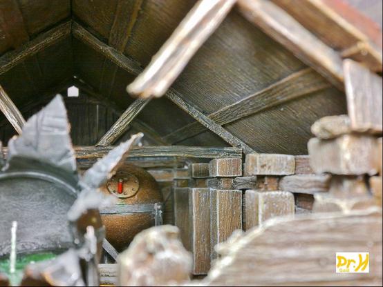 View of the inside of the hut kit example build, showing the underside of the roof and a row of posts.