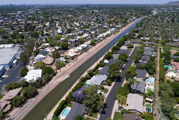 photo - aerial - oblique - aqueduct cuts through suburban development in Arizona