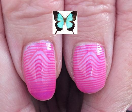 two thumbs side by side in a semi warm state, with pink lines stamped on them.