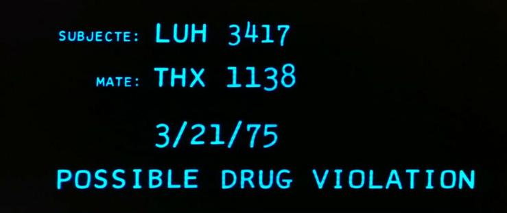 Text on a screen reading: "subjecte: LUH 3417, mate: THX 1138, 3/2/75, possible drug violation." It spells subject with an extra E on the screen.