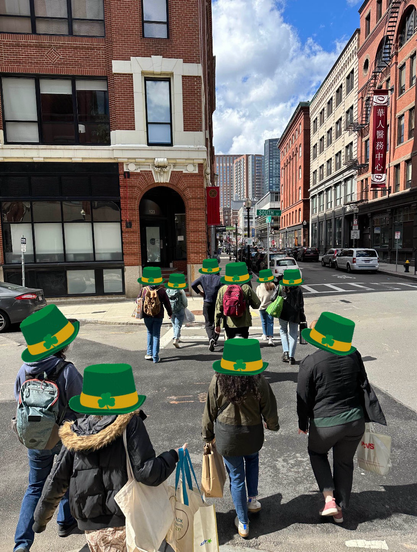 A group of walking walking in the downtown away from the crowds.