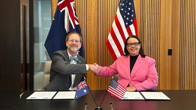 photo - USGS Director David Applegate and Minister for Resources and Northern Australia Madeleine King sign joint statement as Australia announces plans to join Landsat Next satellite mission.