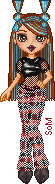 A small pixel doll of a Latina girl with red hair with blue streaks done up in inverted bunned pigtails, a shiny black crop top, mesh undershirt, black, red, and white plaid pants, and black pointy shoes.