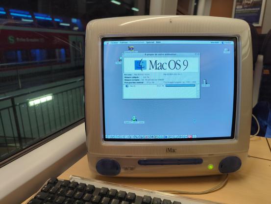 our favourite Mac, booted to the desktop, showing System Profiler. We have 64MB of RAM, little below a half of which is used by Finder. The icons on the desktop are scattered semi-randomly, suggesting that this machine was used quite extensively.
